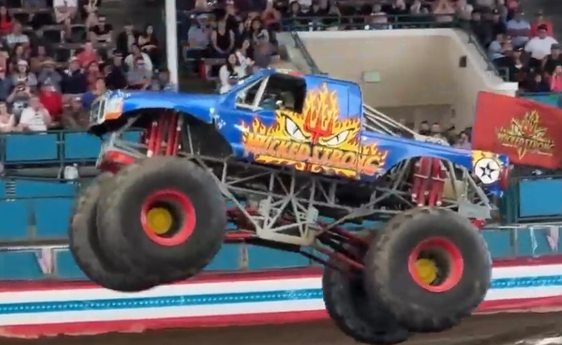 Wicked Strong monster truck performing in an arena